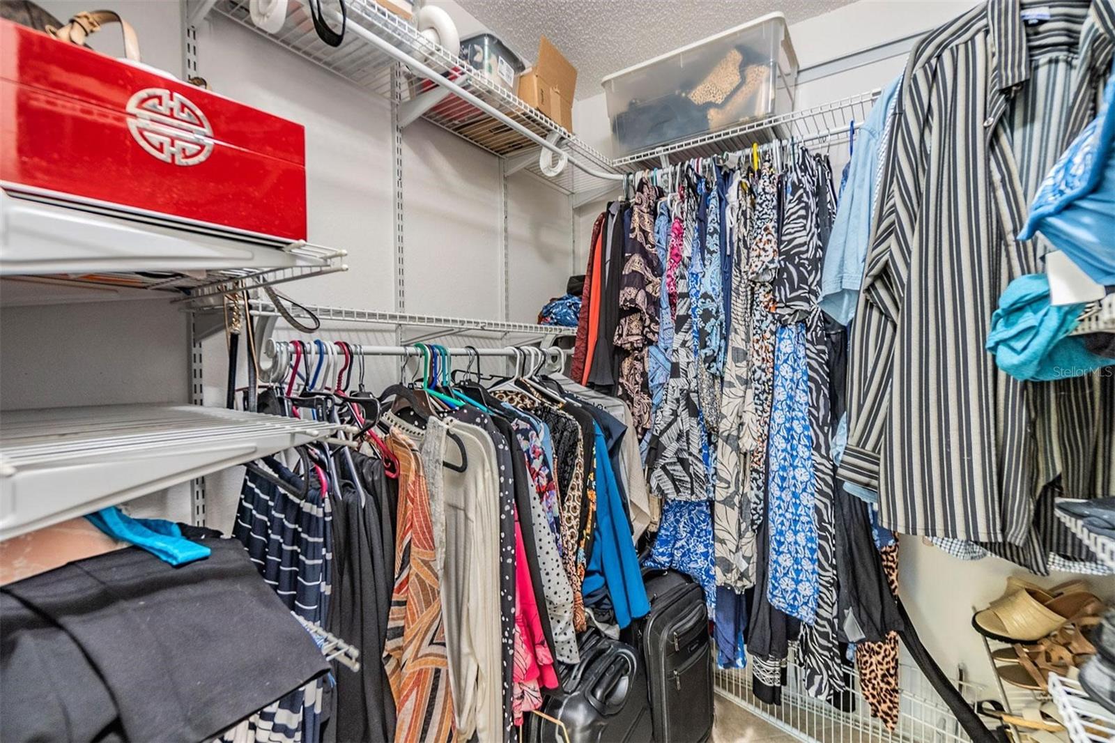 Primary bedroom walk-in closet