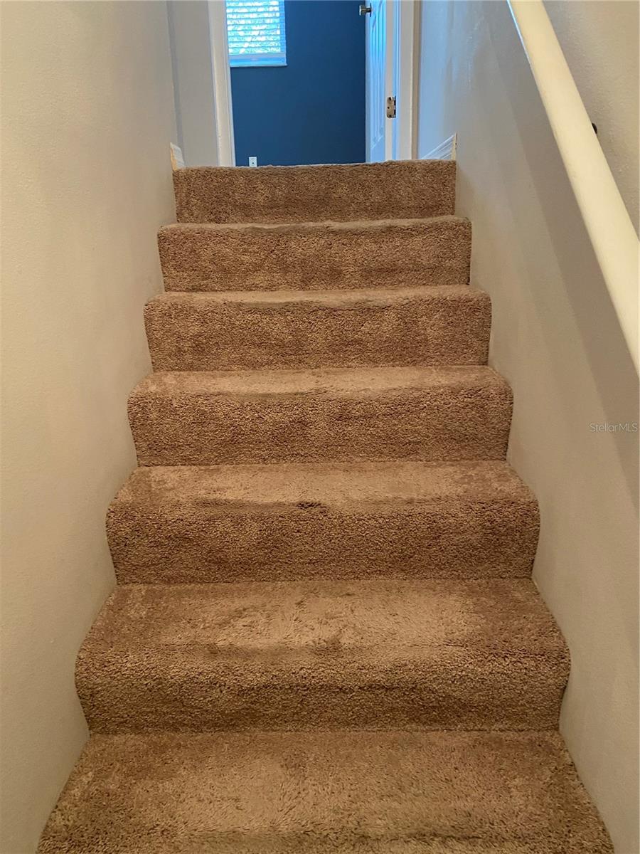 L shaped staircase to bedroom and bonus room/loft