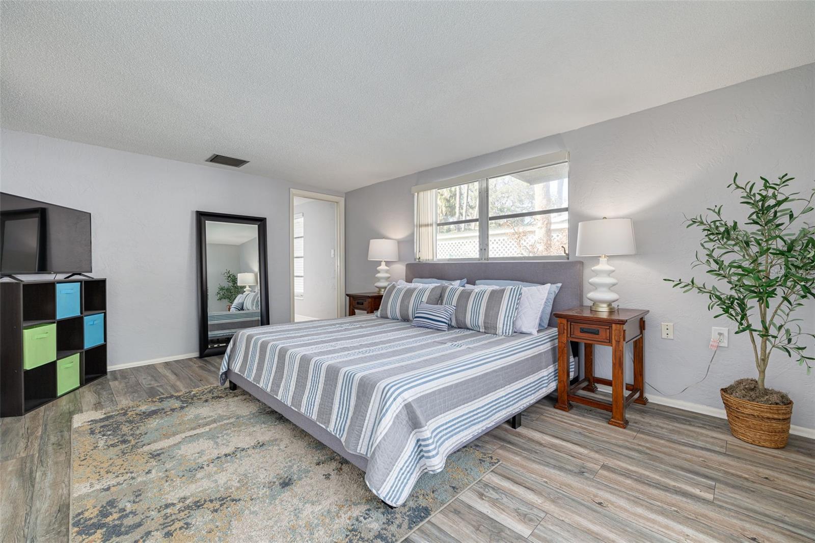 Primary bedroom with slider to lanai