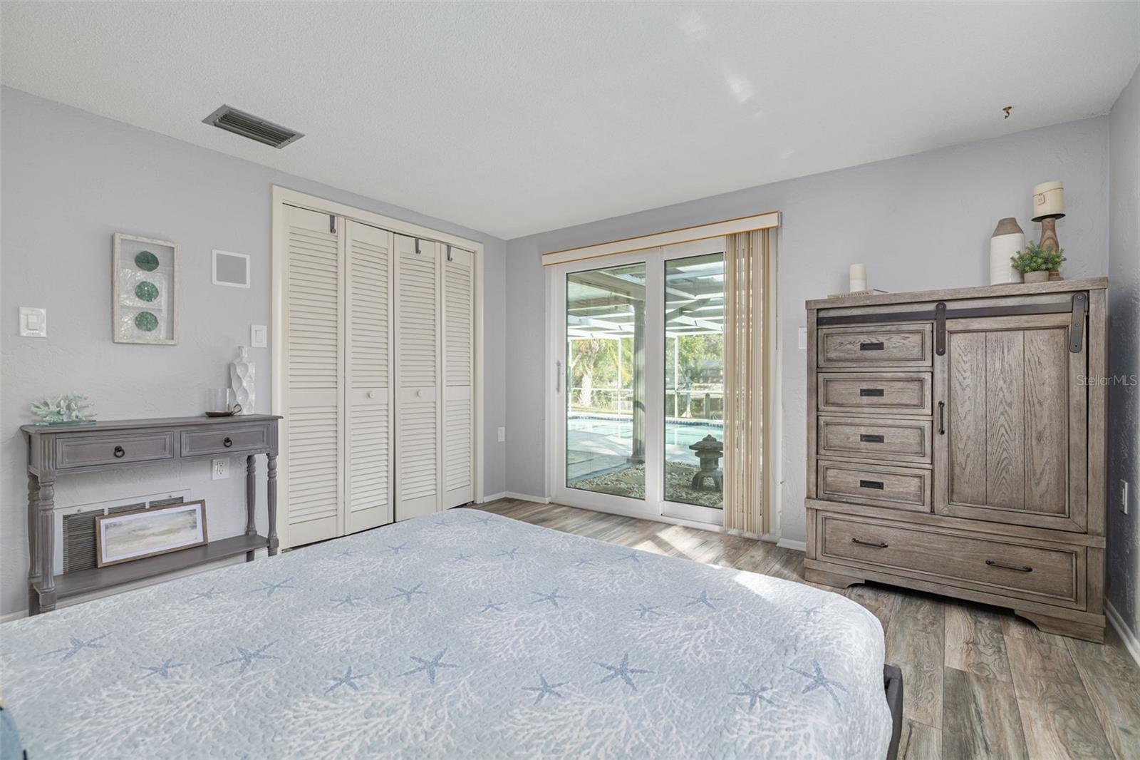 Guest bedroom with slider to lanai