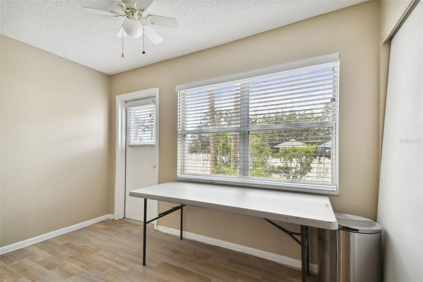 Two large windows overlooking path to pool