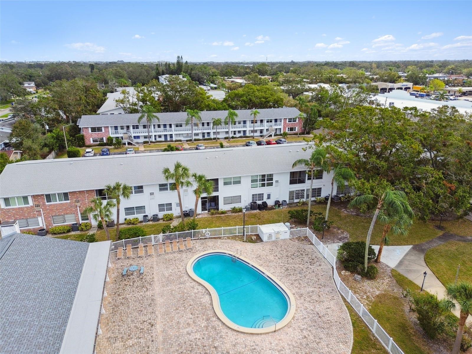 Aerial view of back of condo unit and pool