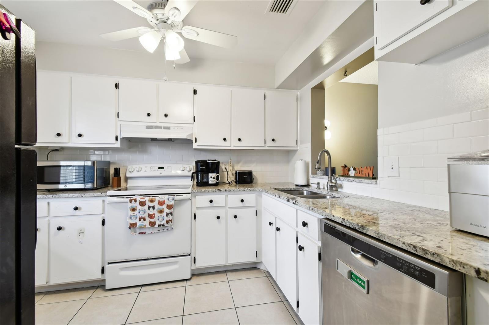 Kitchen with white painted cabinets