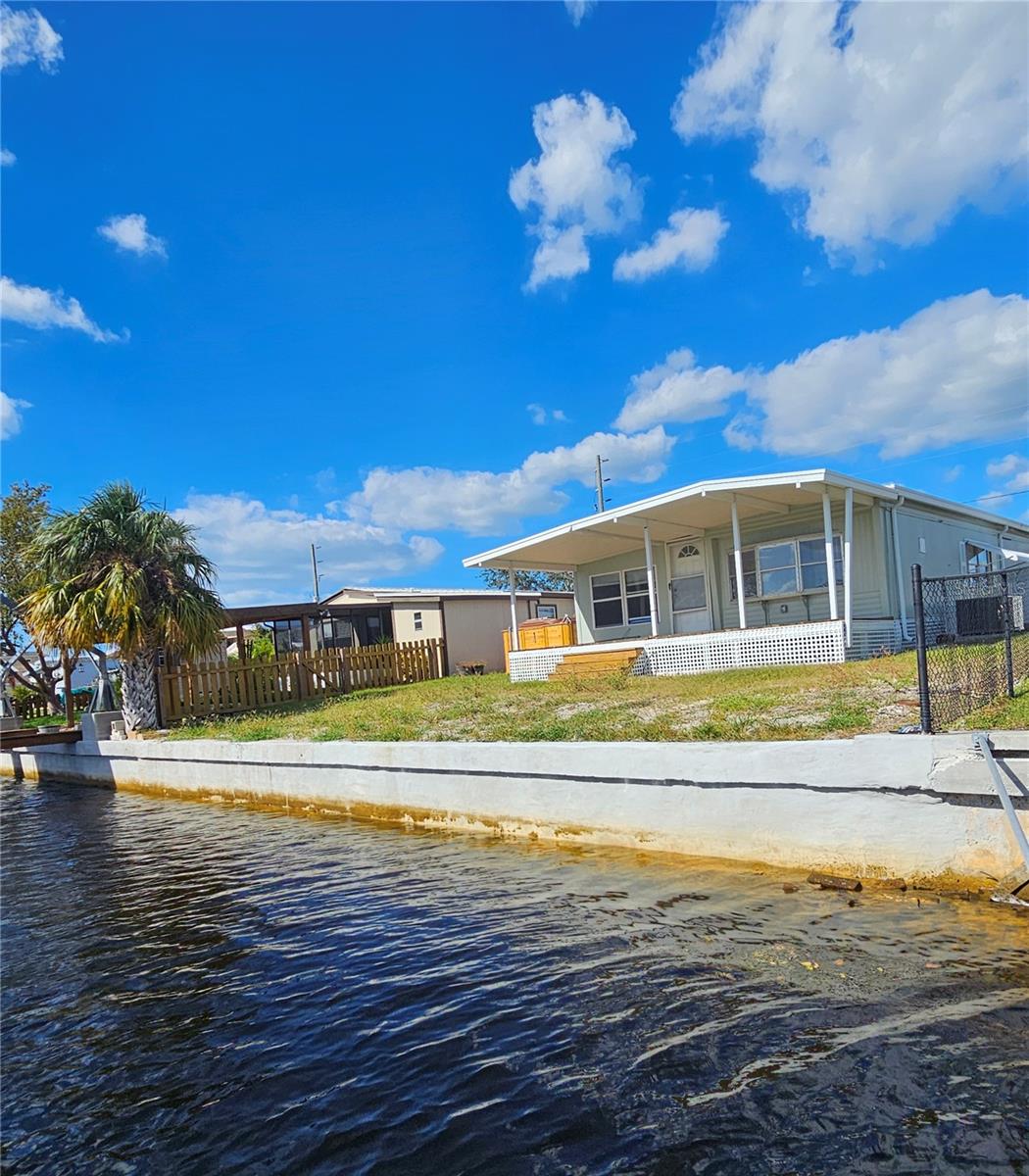 Canal side. Notice the brand 2024 new 50 ft sea wall!