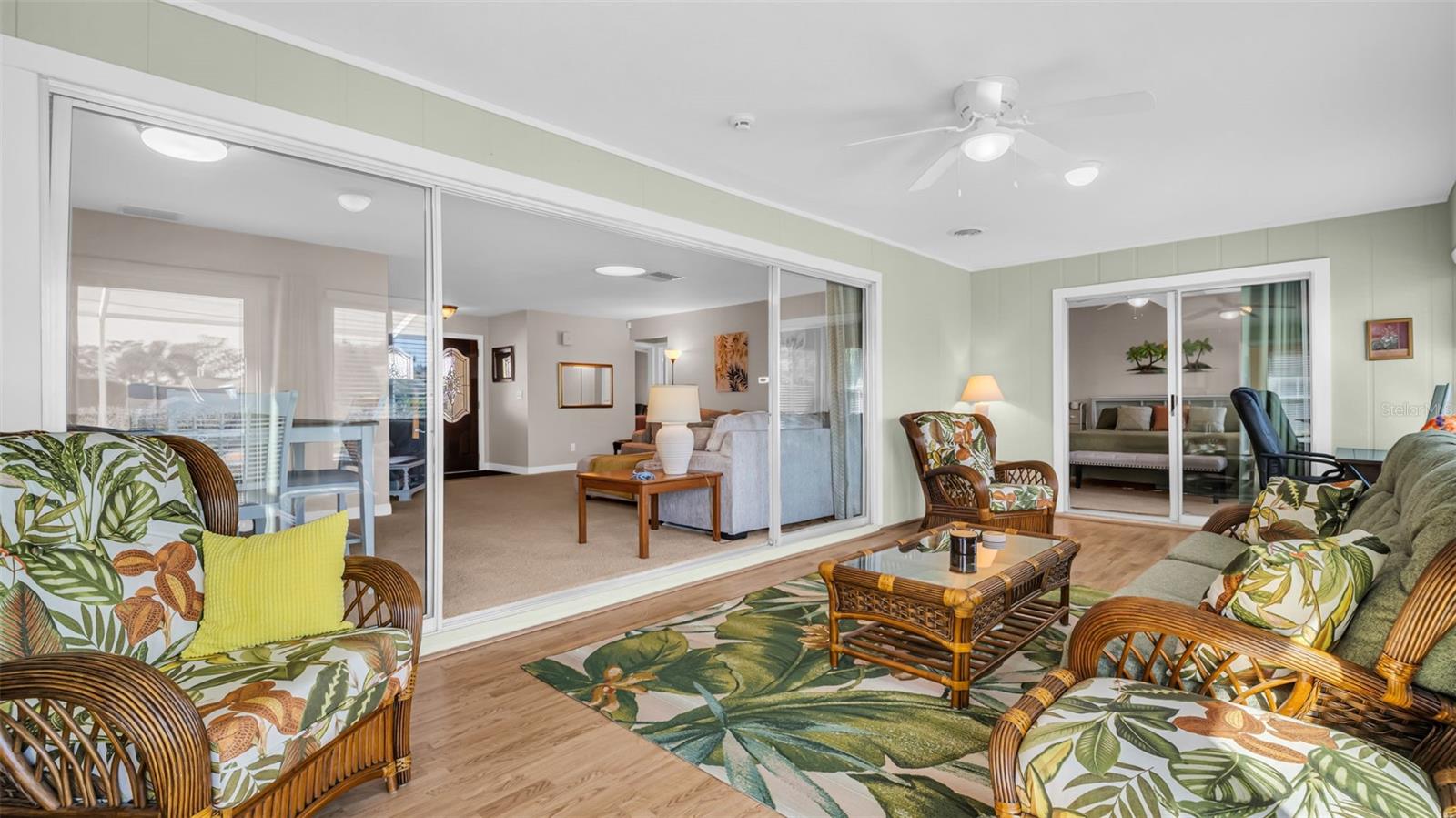 A tropical paradise off the living room, kitchen and primary bedroom