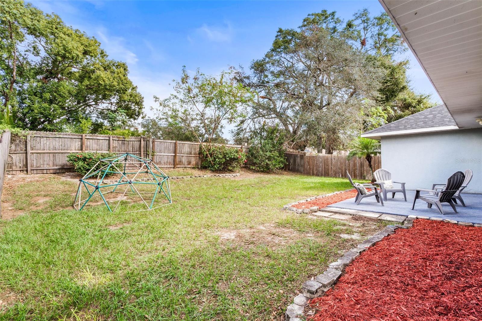 Backyard space for grilling and gardening