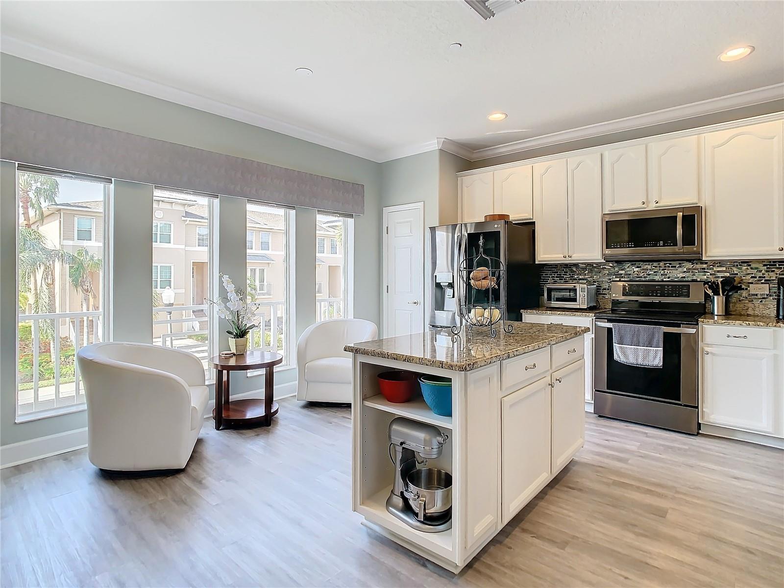 The kitchen has lots of light  and space plus notice the closet pantry