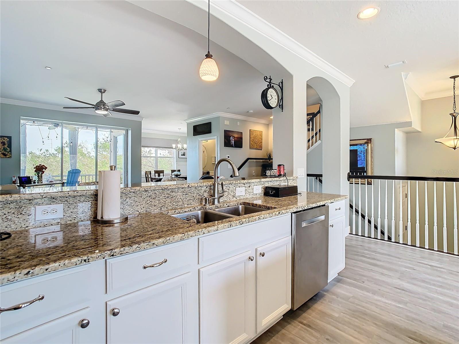 Notice the kitchen overlooks the living room and has a lovely view  of the trees outside.