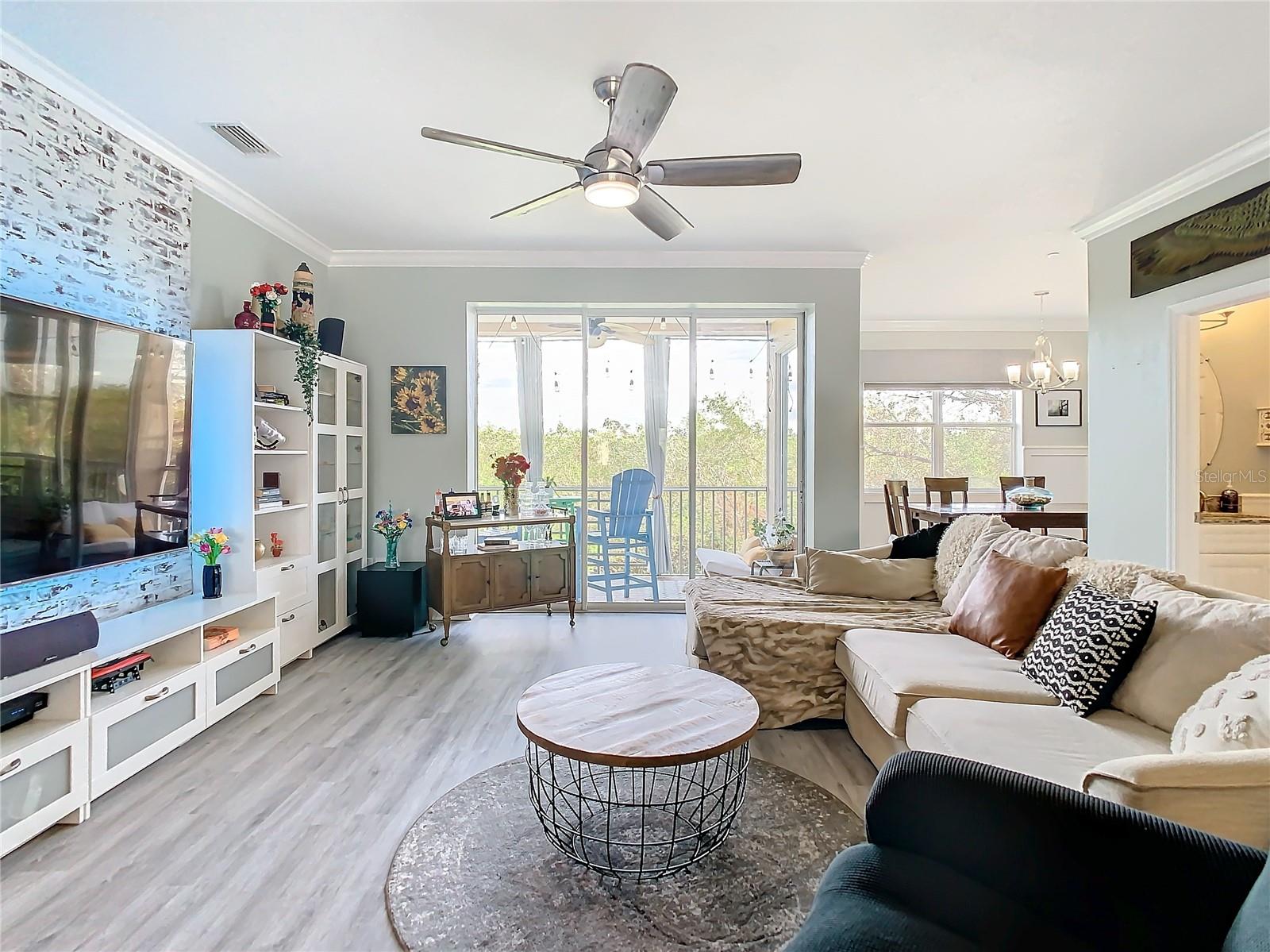 This shows how spacious your living room is.  There is faux brick on the one wall with the television that could be removed if the new owner wanted to do that.