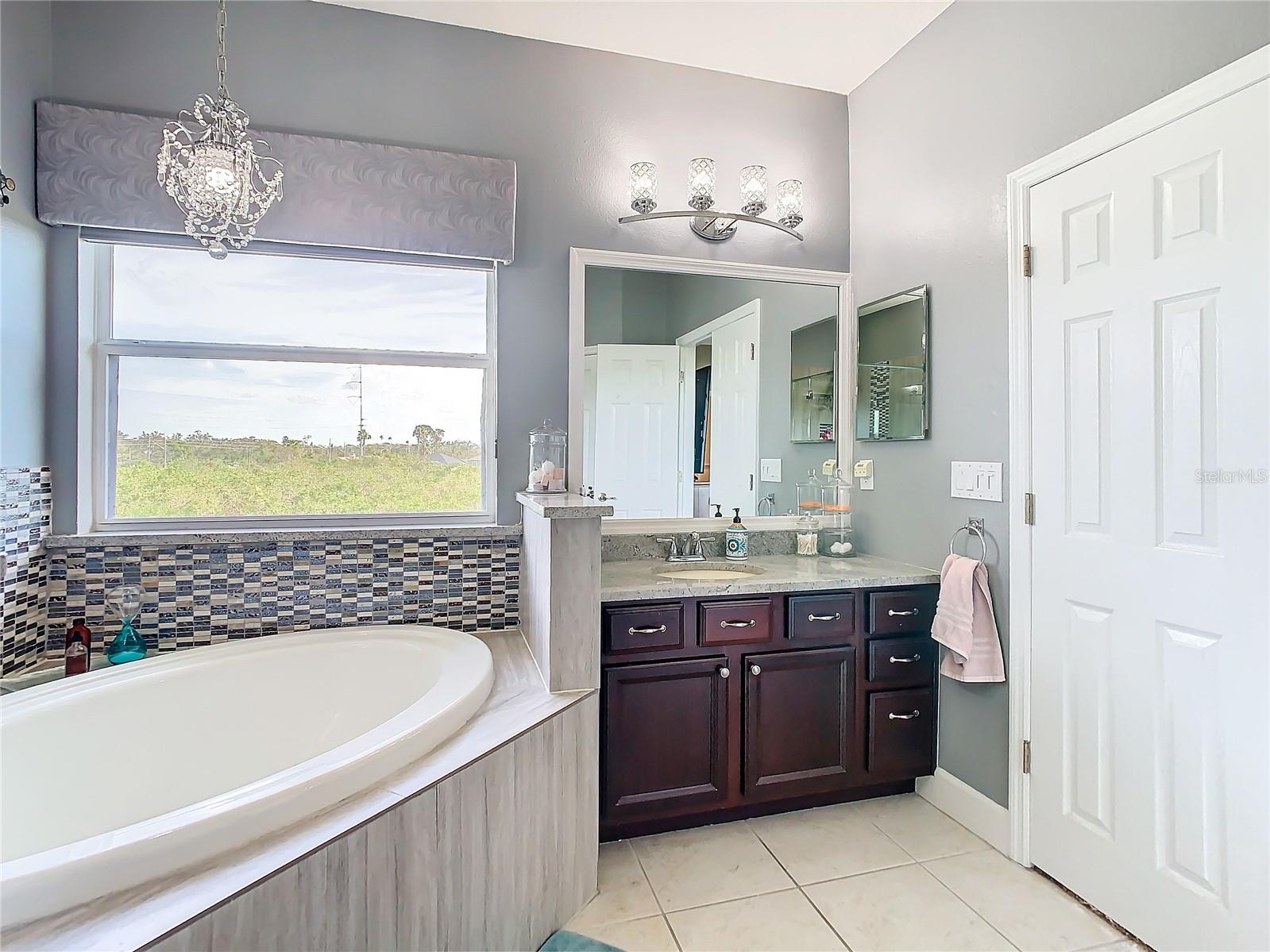 This is a view of the 2nd vanity and tub in the primary bath