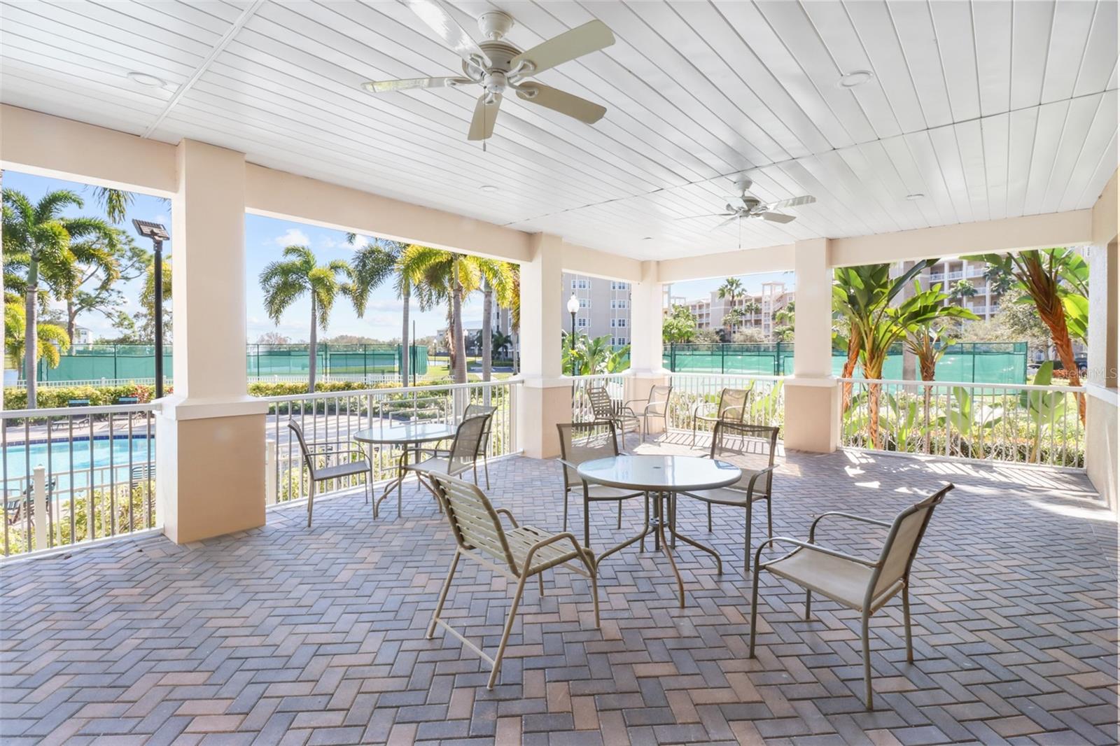 Patio  that overlooks the pool and tennis courts