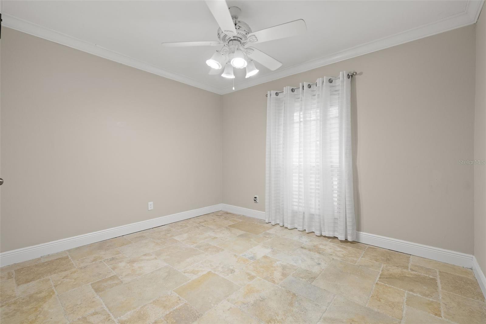 Window gives some natural light in the guest bedroom