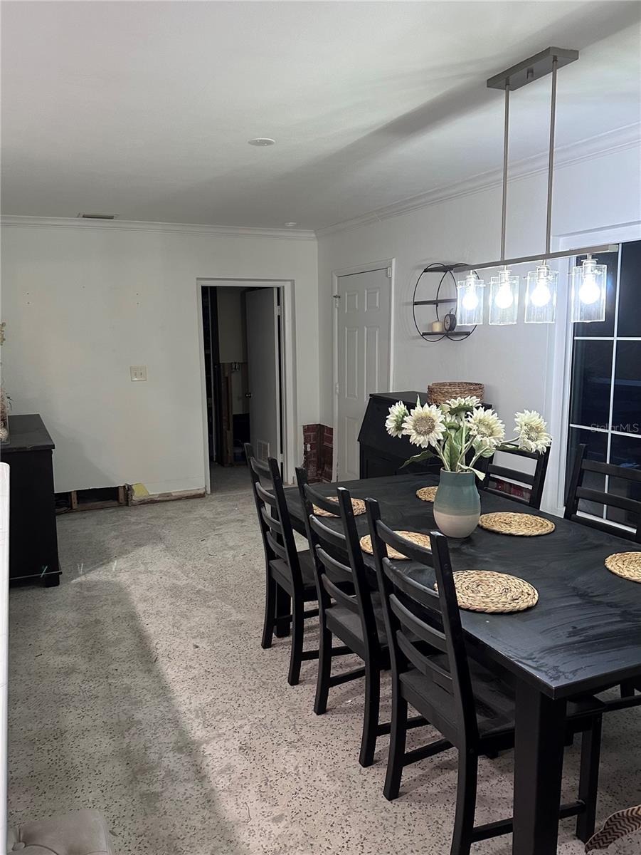 Dining room off the kitchen with window looking out to covered lanai.