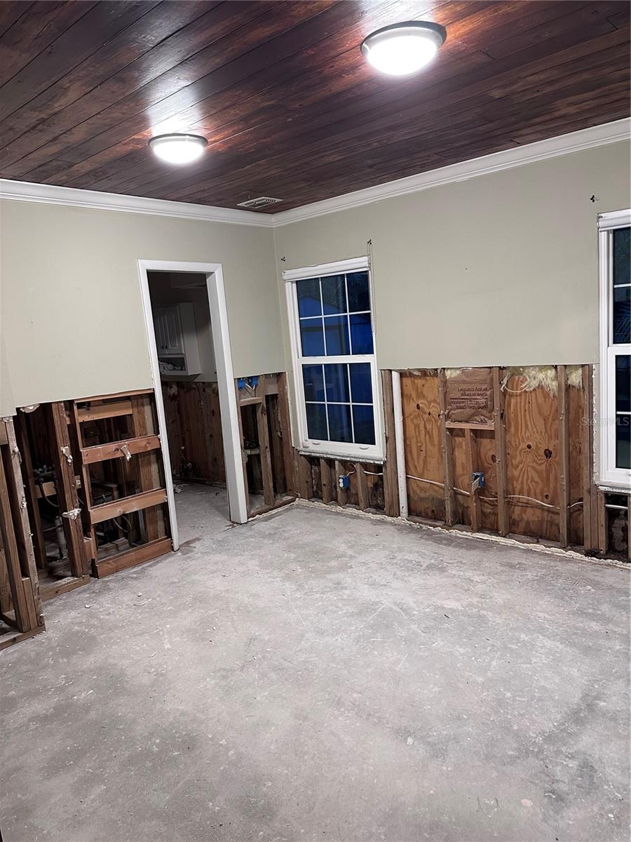 Primary Bedroom. Windows overlook backyard.