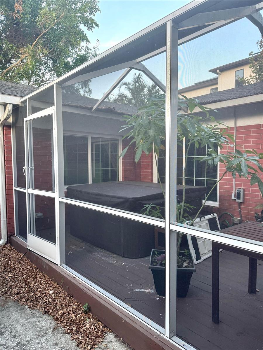 Screened in lanai provides extra living space. Hot tub is an added bonus.