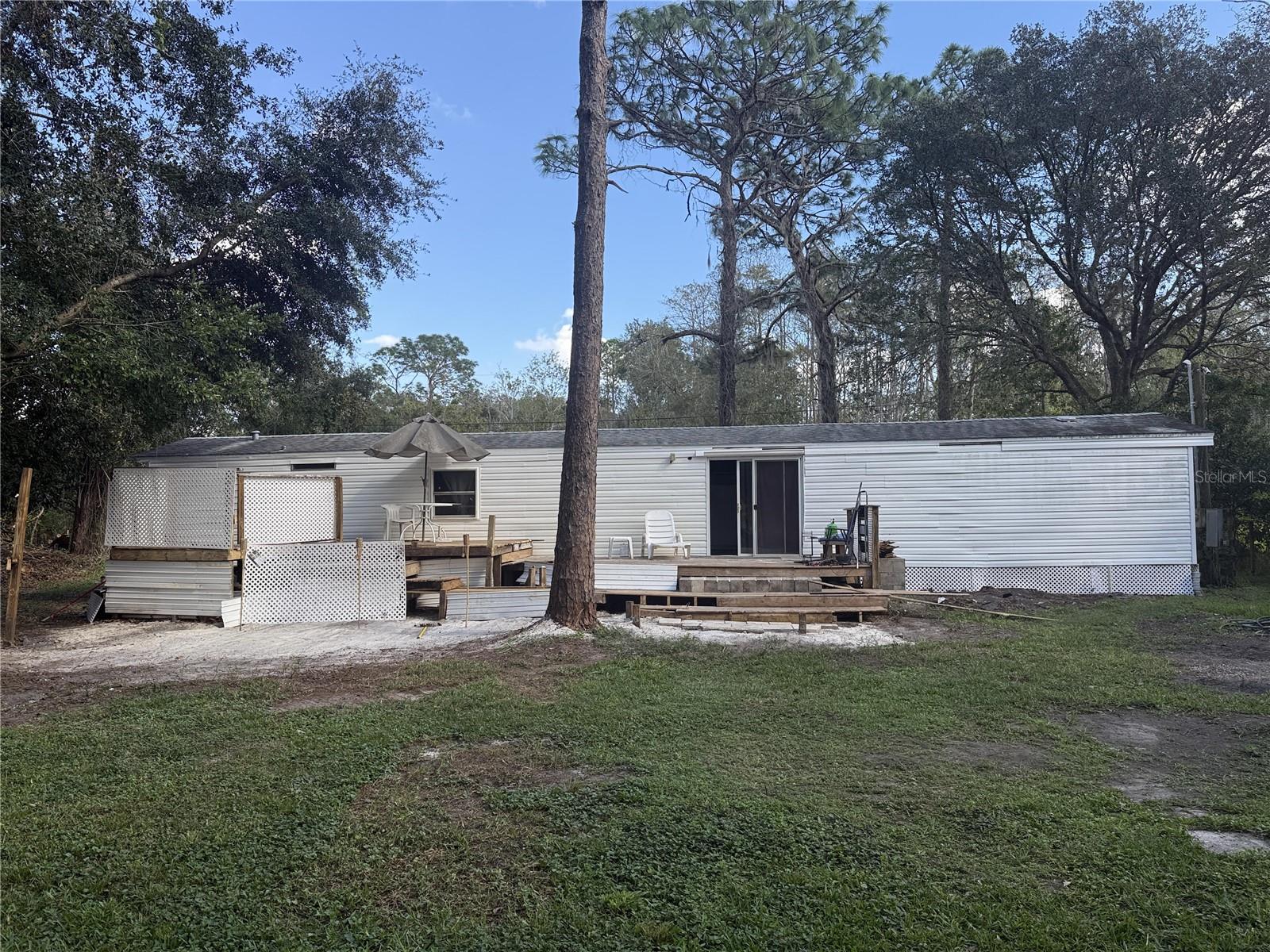 rear of home with large wood deck