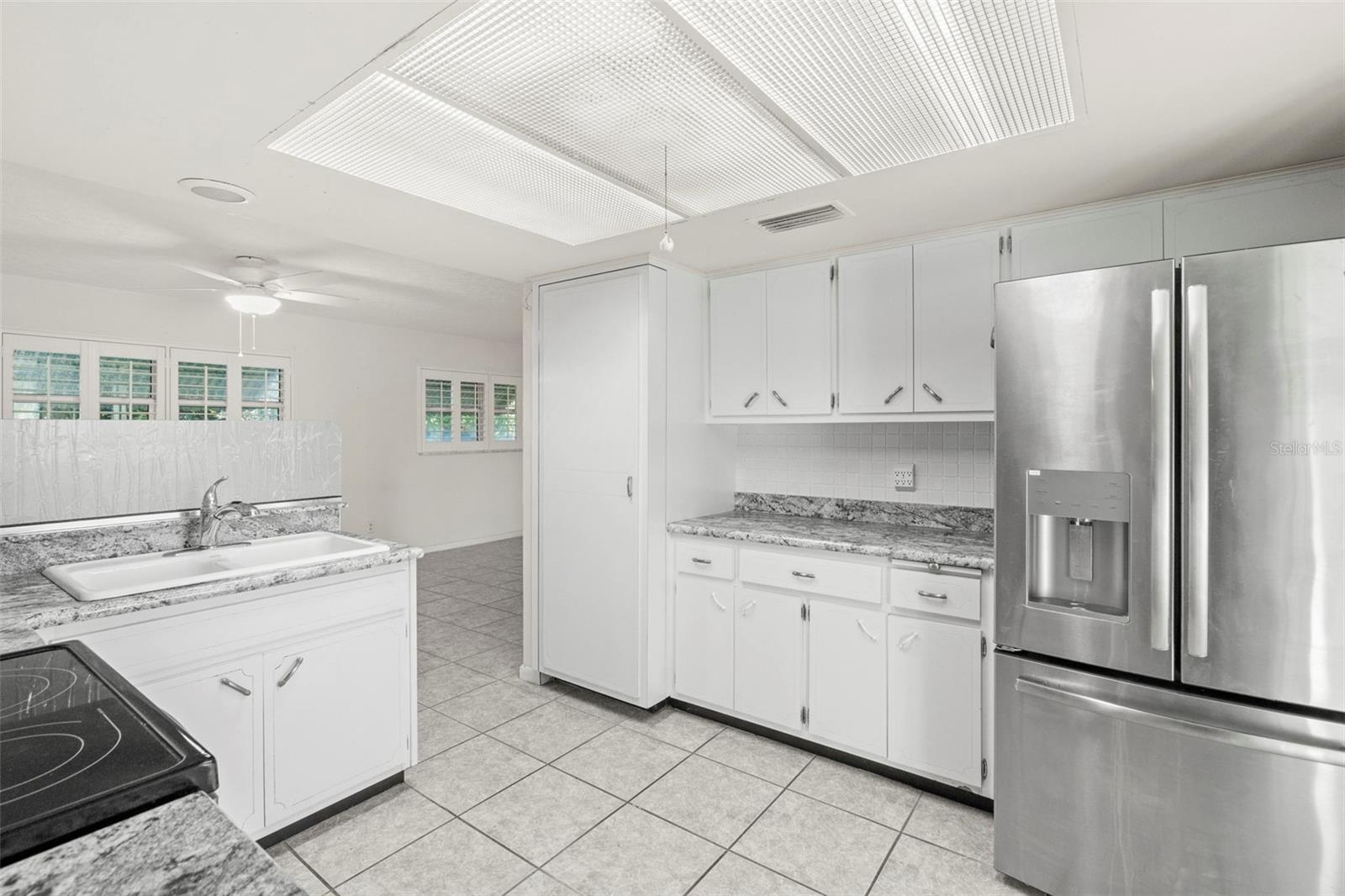 Kitchen has a unique pantry closet