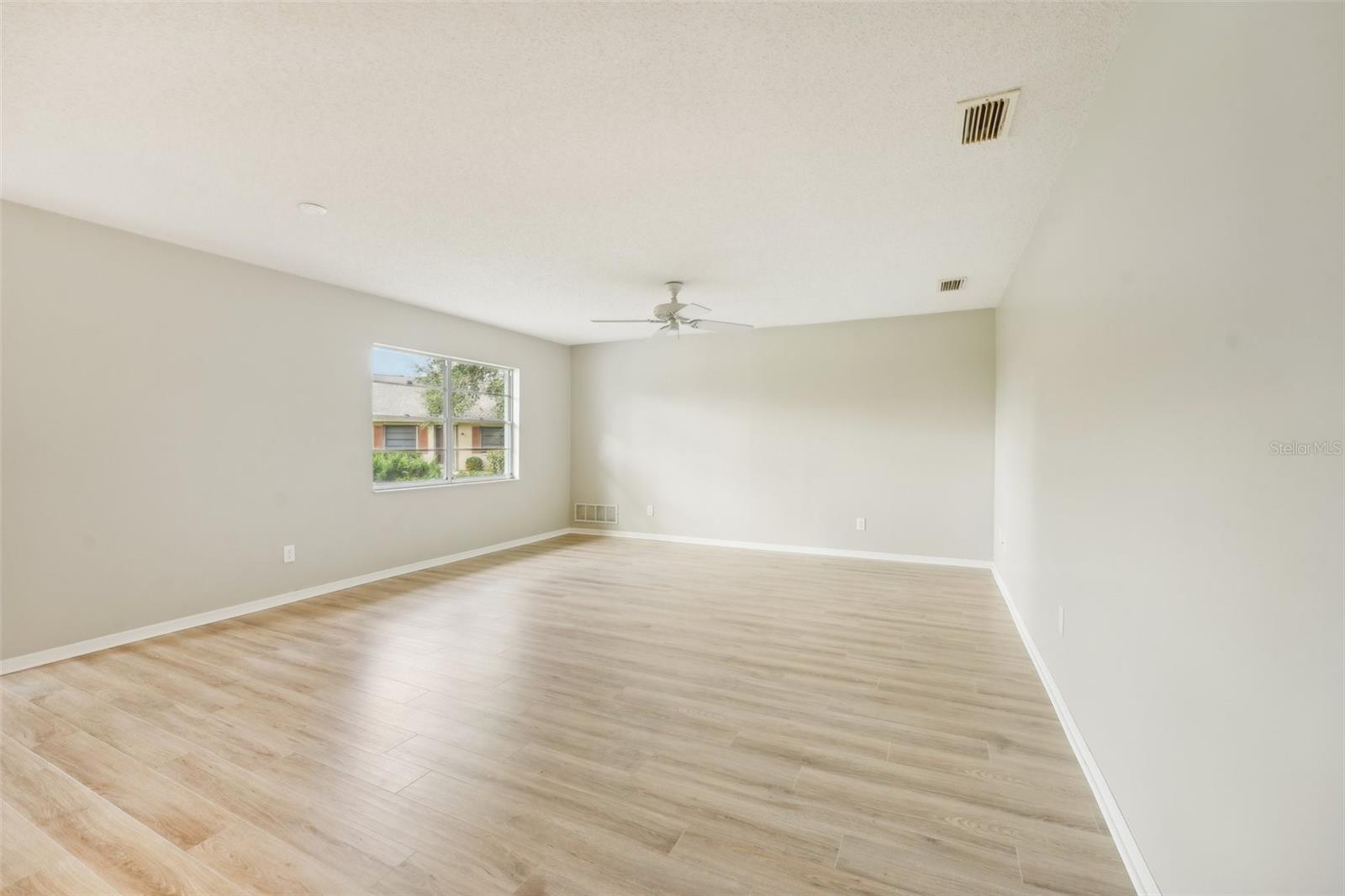 LIVING ROOM-FRESHLY PAINTED AND NEW FLOORS THROUGHOUT