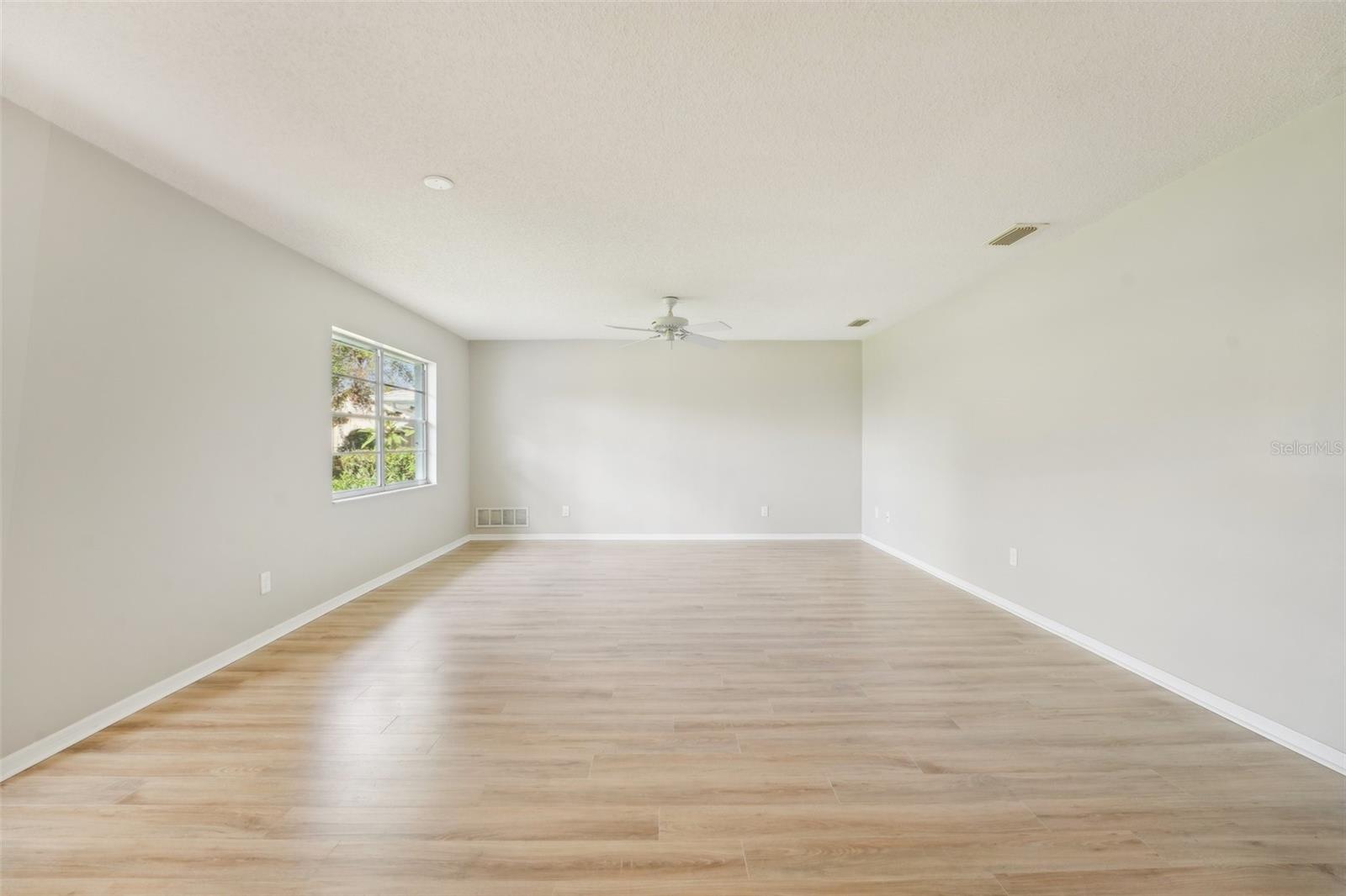 LIVING ROOM-FRESHLY PAINTED AND NEW FLOORS THROUGHOUT