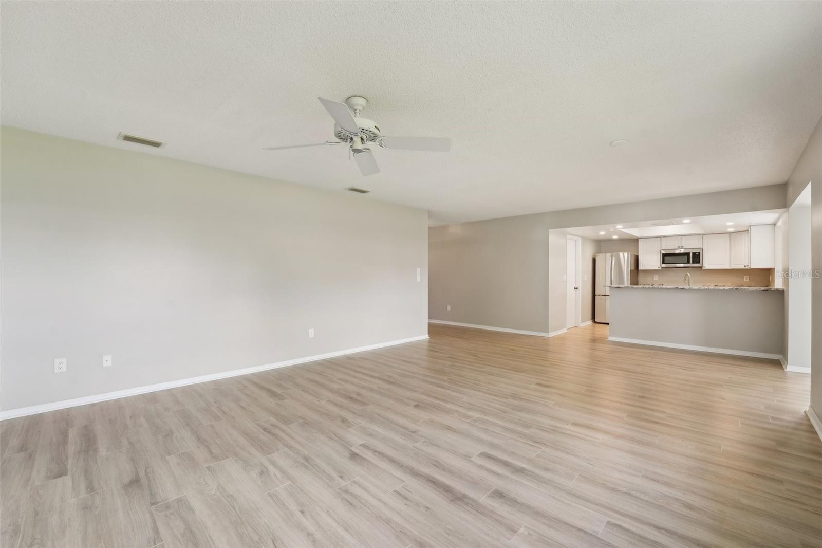 LIVING ROOM-FRESHLY PAINTED AND NEW FLOORS THROUGHOUT