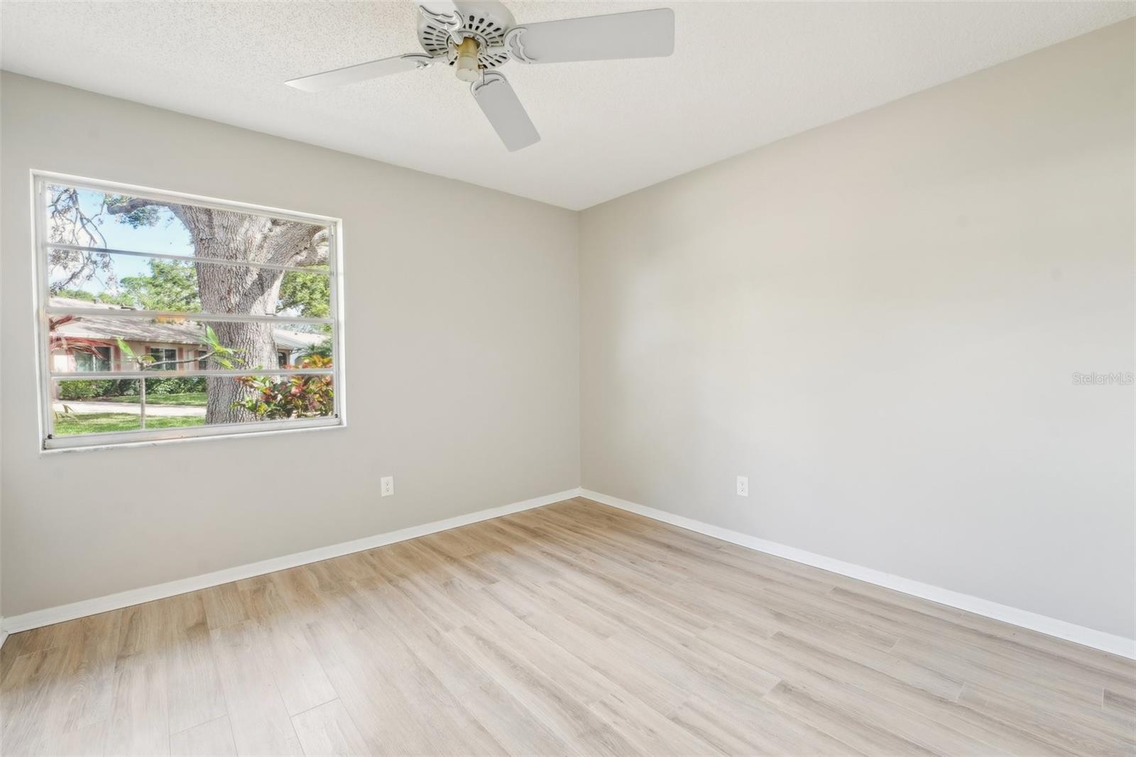 BEDROOM 2-FRESHLY PAINTED AND NEW FLOORS THROUGHOUT