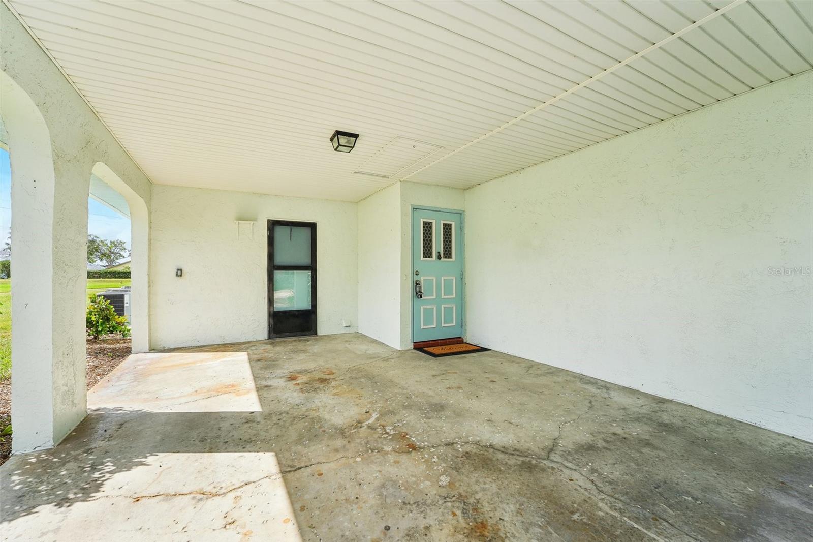 CARPORT WITH ACCESS TO LAUNDRY ROOM AND HOUSE