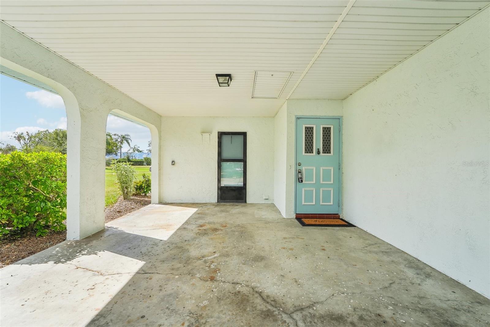 CARPORT WITH ACCESS TO LAUNDRY ROOM AND HOUSE