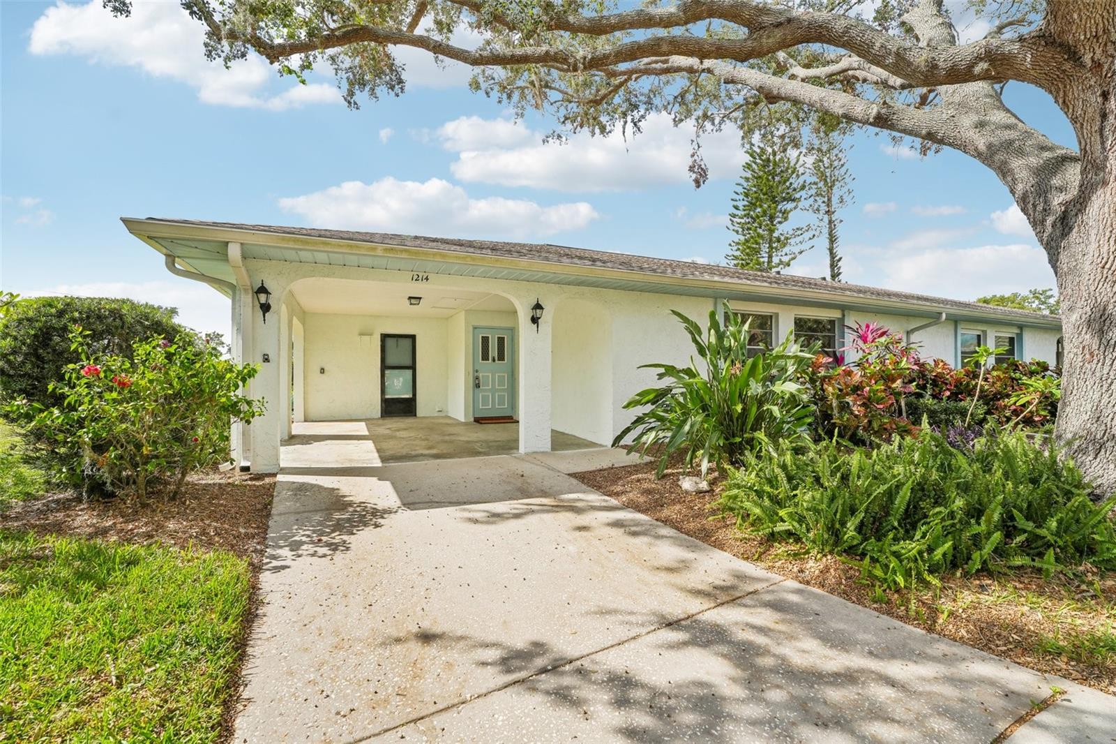 CARPORT WITH ACCESS TO LAUNDRY ROOM AND HOUSE