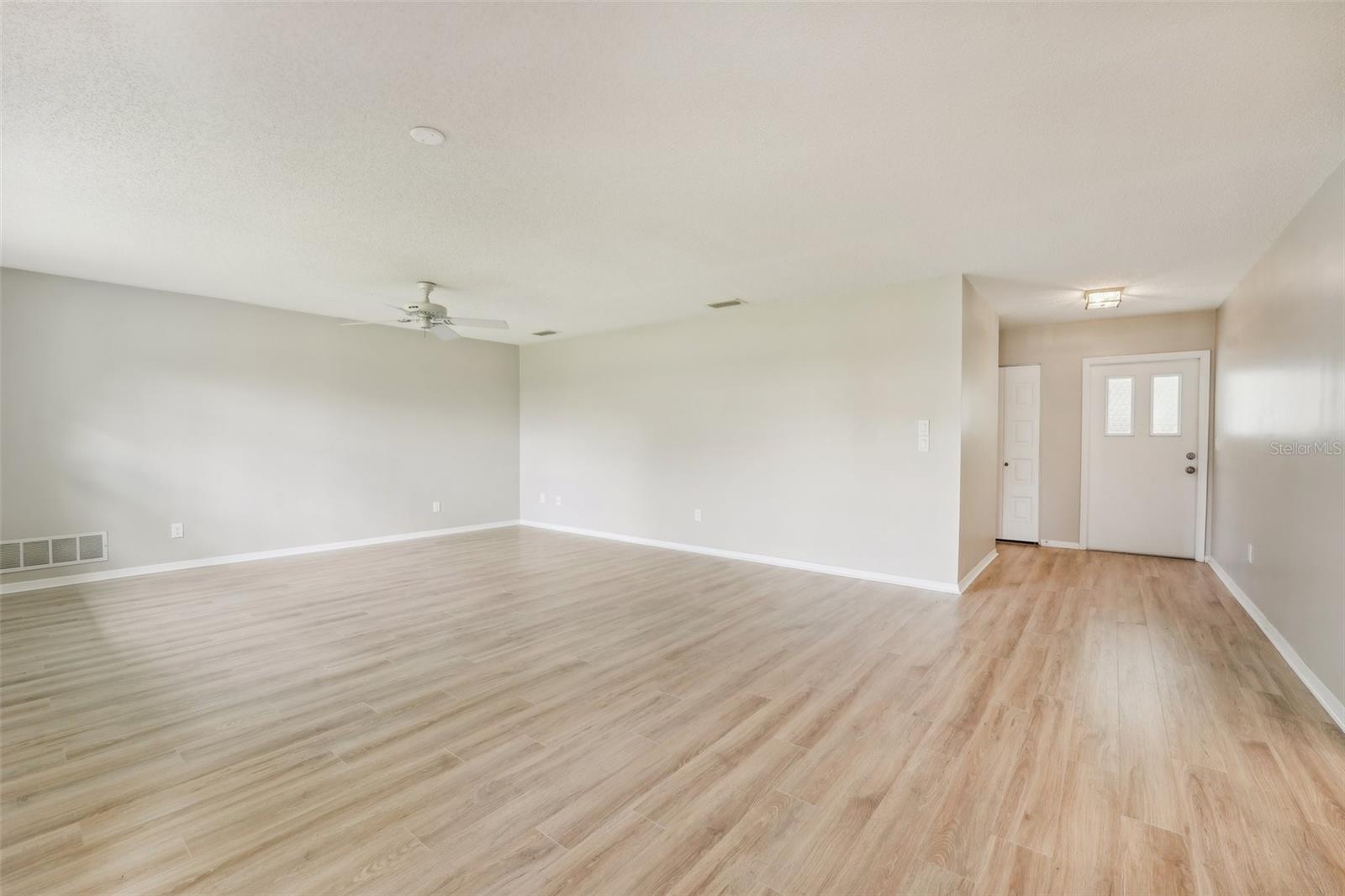 ENTRY AND LIVING ROOM-FRESHLY PAINTED AND NEW FLOORS THROUGHOUT