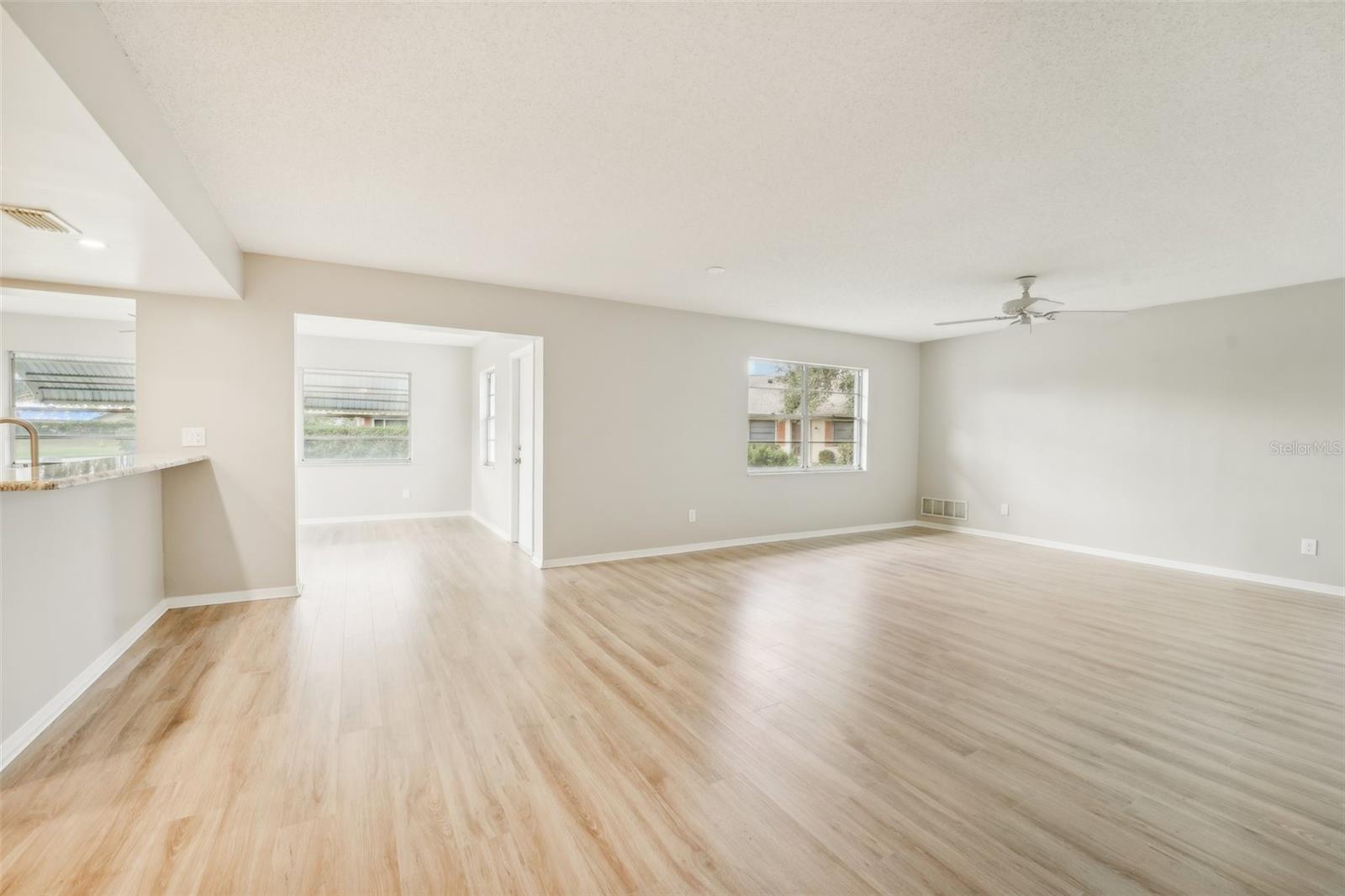 LIVING ROOM-FRESHLY PAINTED AND NEW FLOORS THROUGHOUT