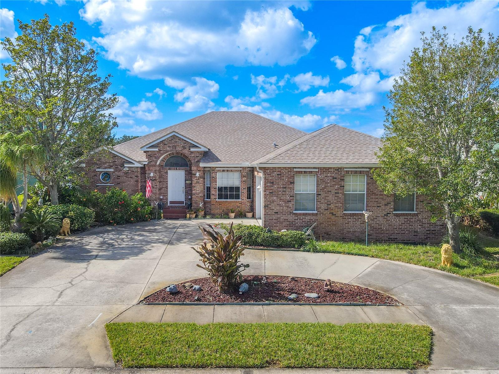 Beautiful, meticulously maintained 4-Bedroom, 2-bath, 2-car garage with Screened in Lanai with Lake View.