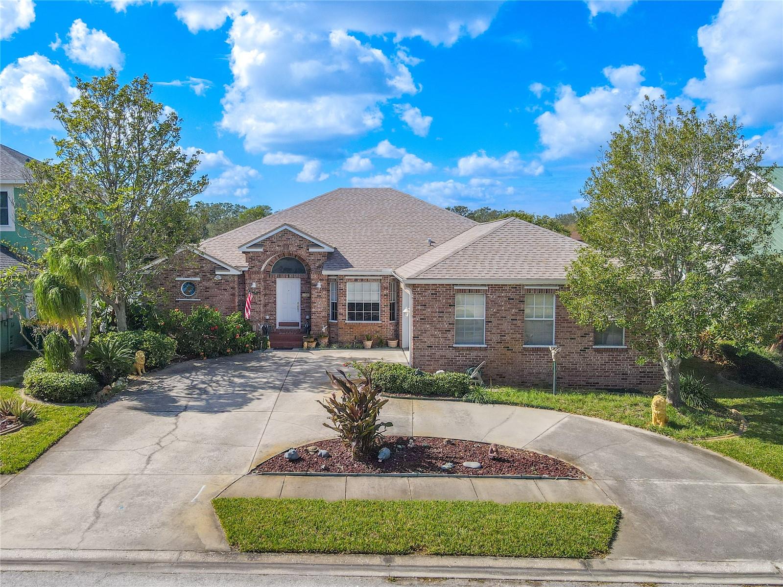 There's a circular driveway with room for additional parking and a 2-car, side facing garage.