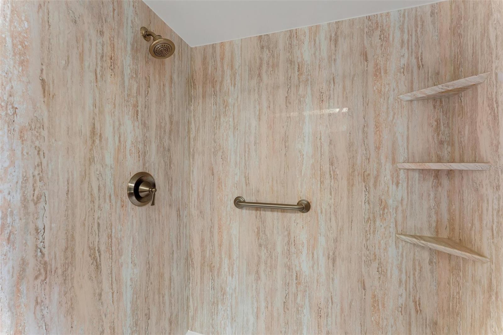 Master walk-in shower with built in shelving & convenient grab bar~