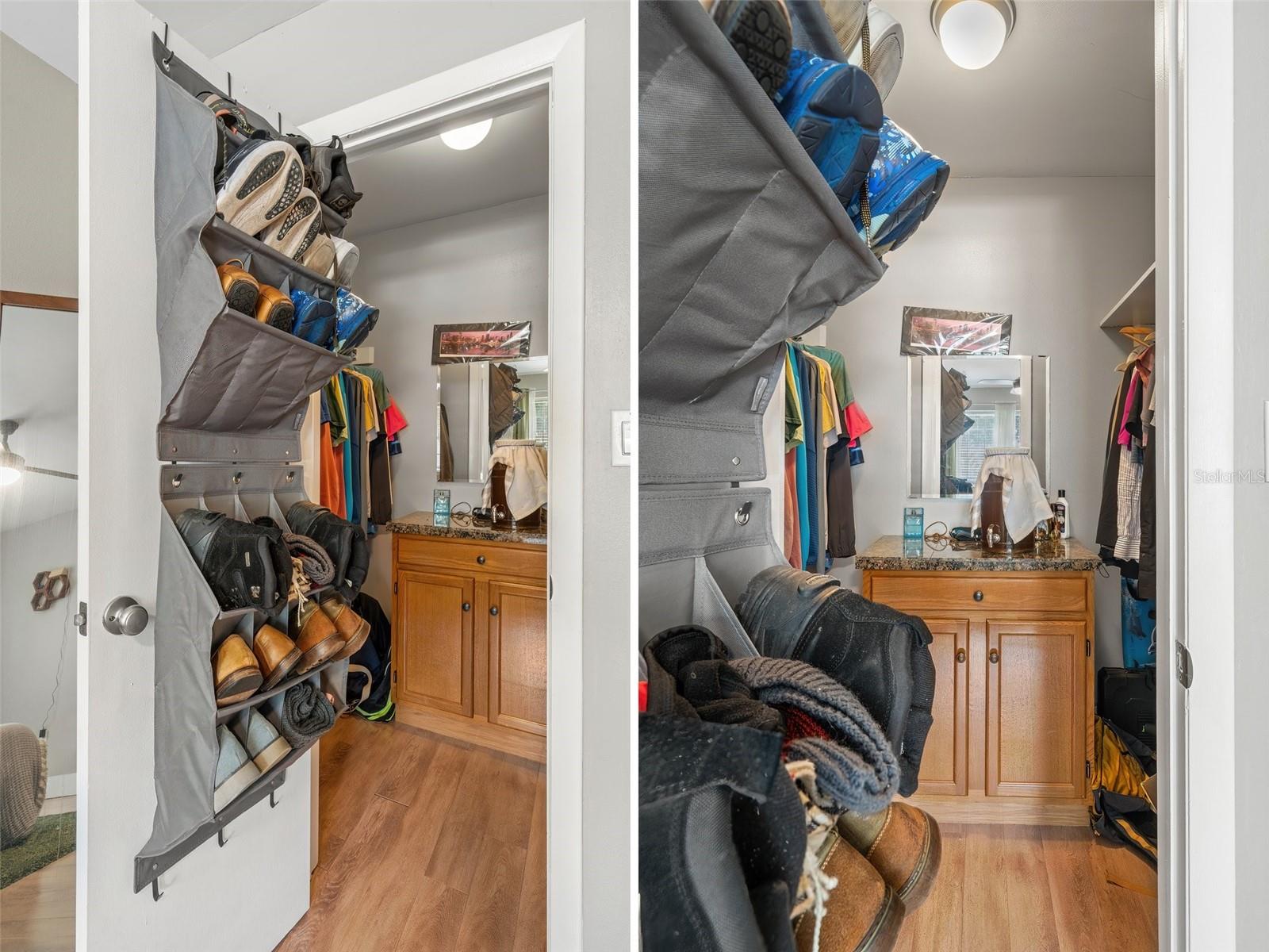 Large walk in closet with dresser.