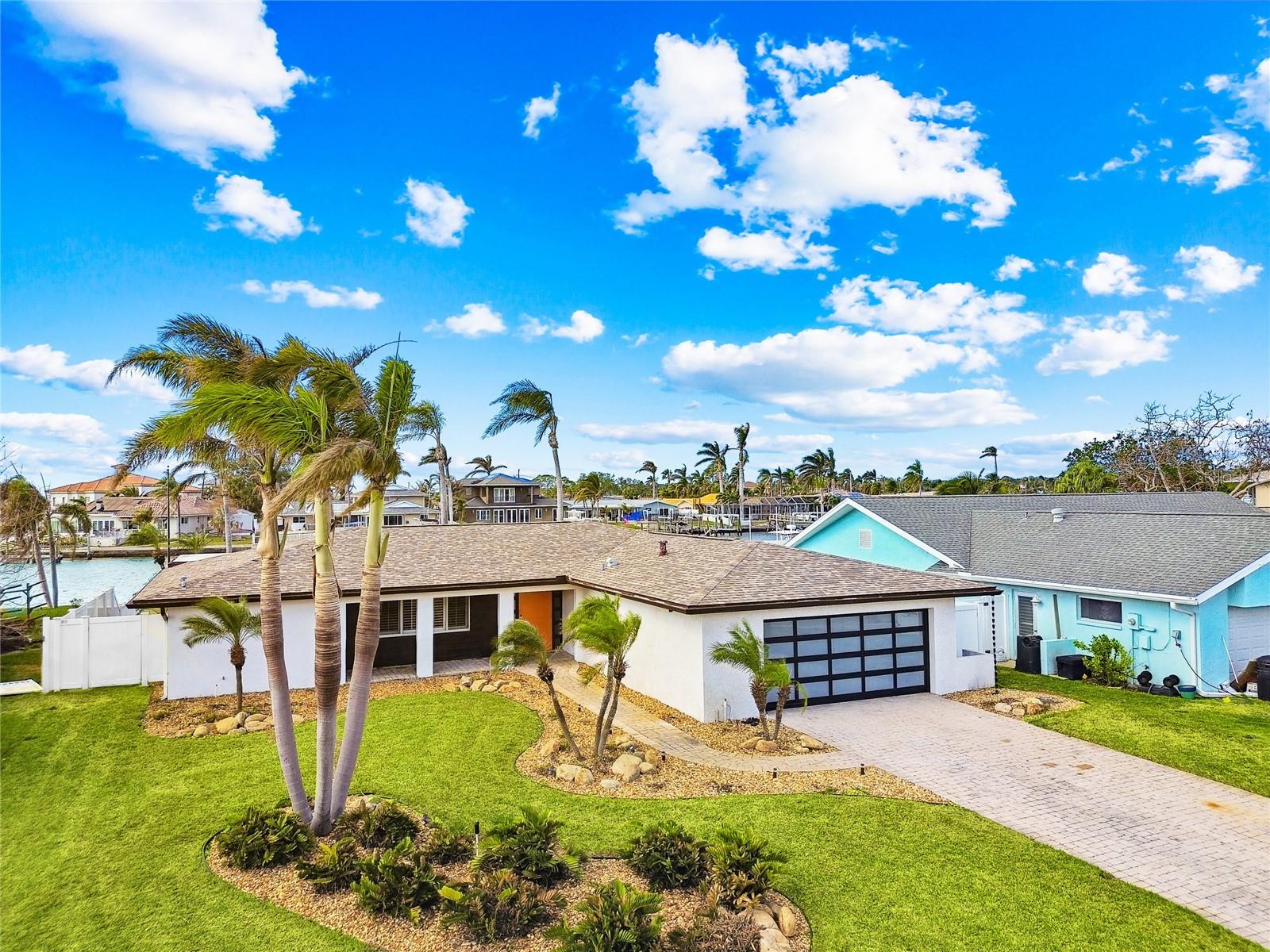 This beautiful home is 2nd from the end of a finger on Boca Ciega Bay and is just north of the Madeira Beach Causeway shown in the background!!