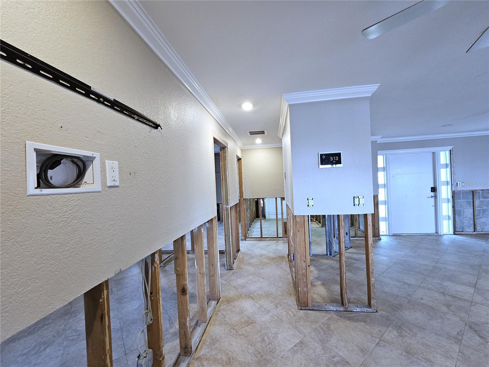 Hallway to 4th Bedroom, Laundry Room, Half Bath & Garage Entrance