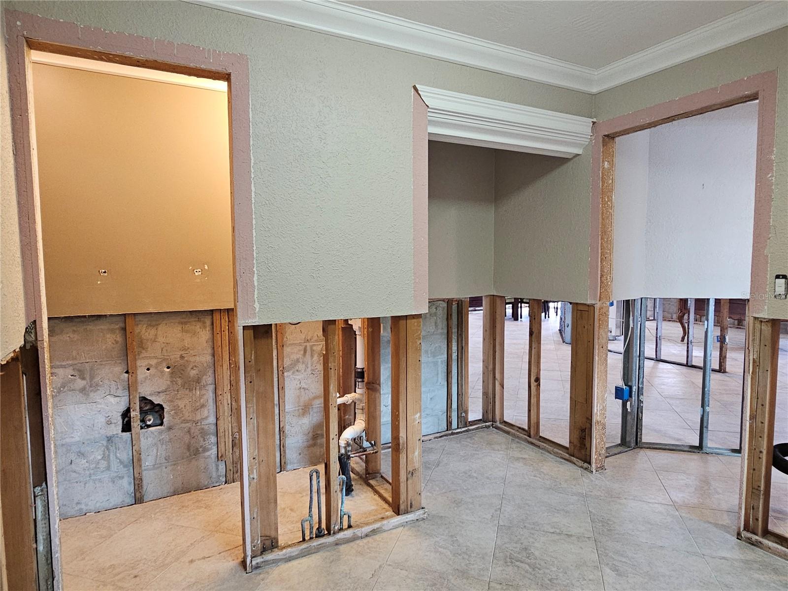 Laundry Room View 2- Door to left goes into Half Bath, Washer & Dryer go in the alcove to the right!