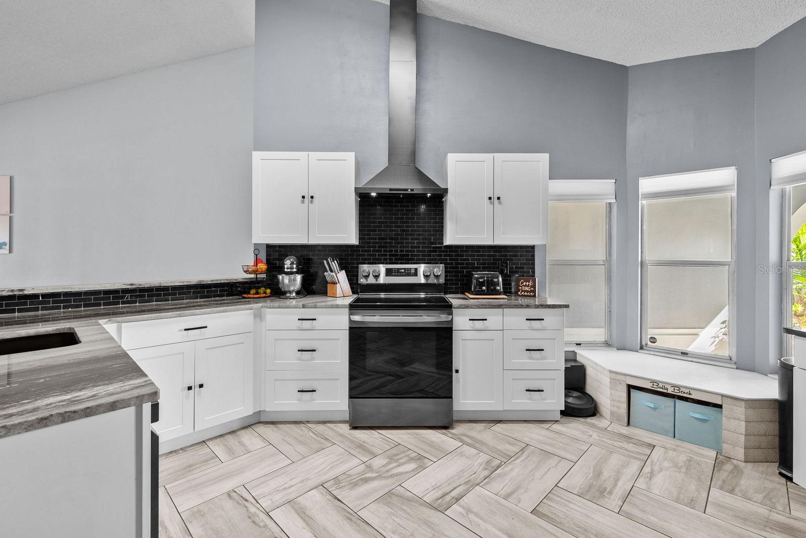 Kitchen with sitting area by window