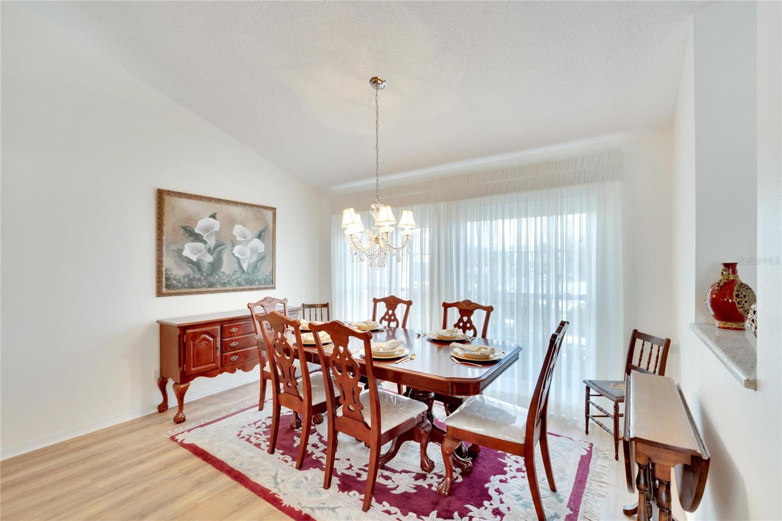 Beautiful formal dining room/ flex space.  Dining room is just steps away from the kitchen, and shares spaces with the living room.