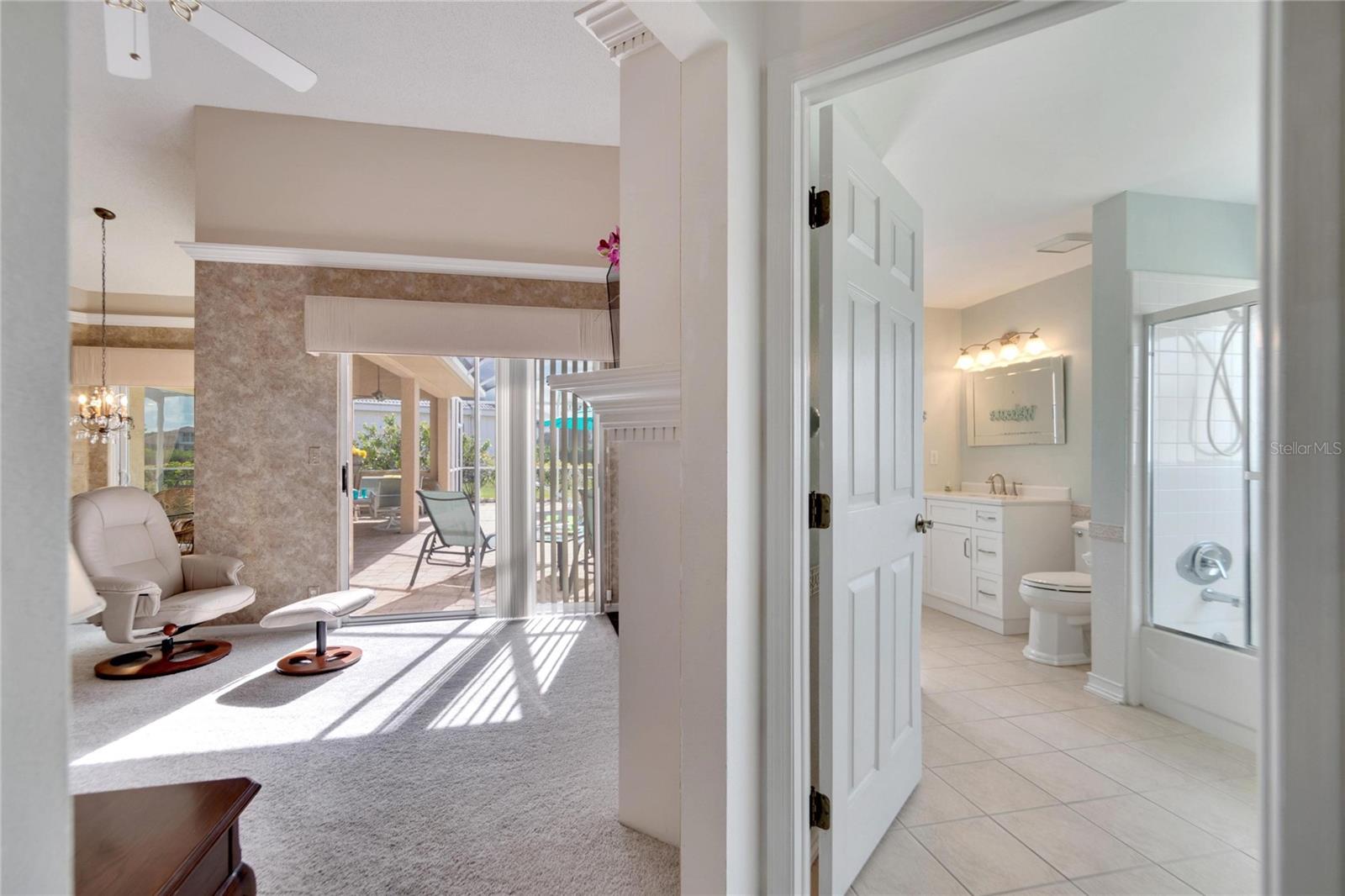 Bathroom number two.  Step in tub with shower.  Convenient door leading to the pool and screened lanai.