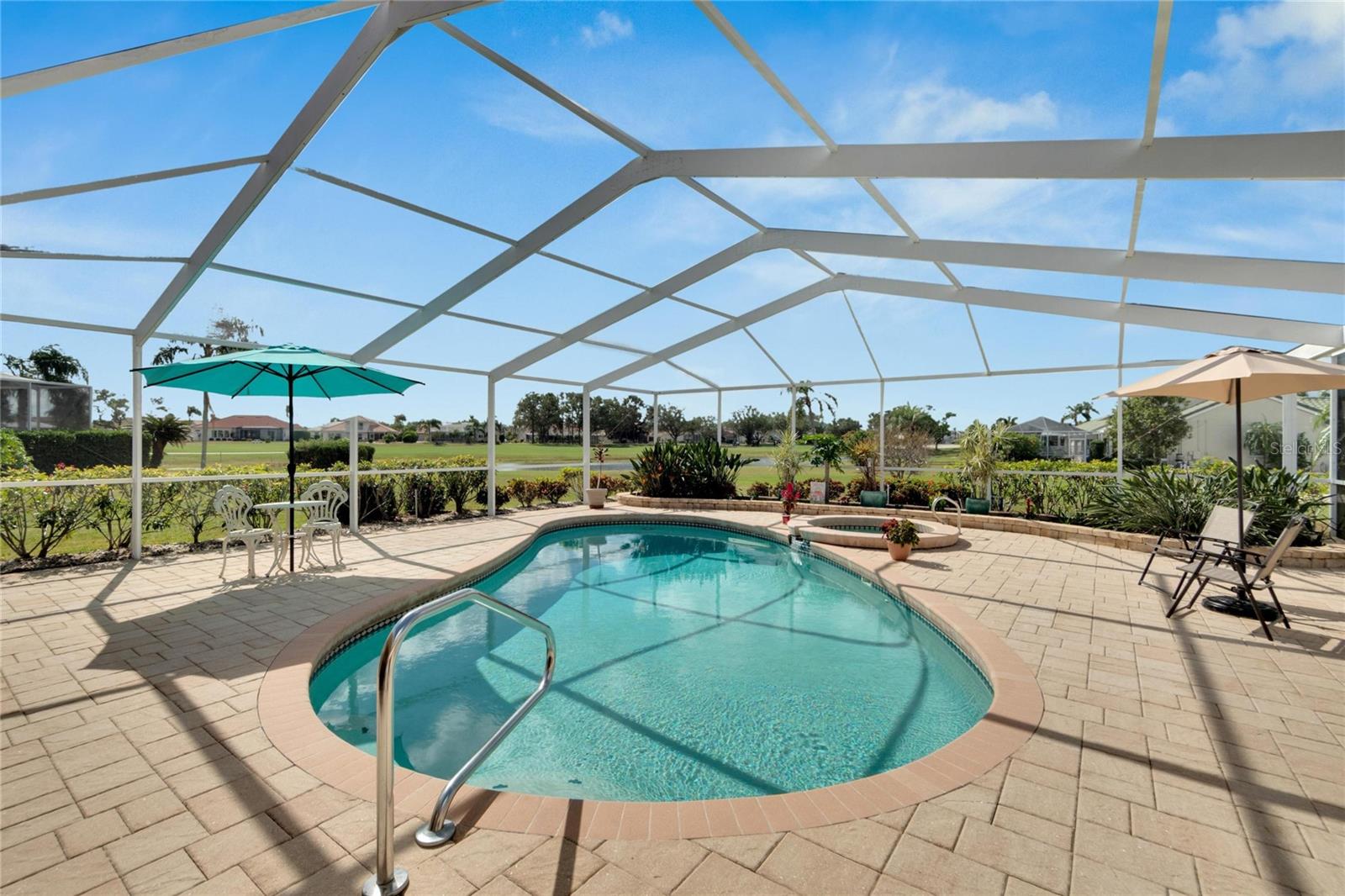 Large screened in, heated pool and spa lanai.  Plenty of room for all outdoor activities. Saltwater, solar heated with electric heat pump for spa.  Pool can be controlled off of an app on your phone.  Current owner are going to leave the pool sweep to aid in cleaning.