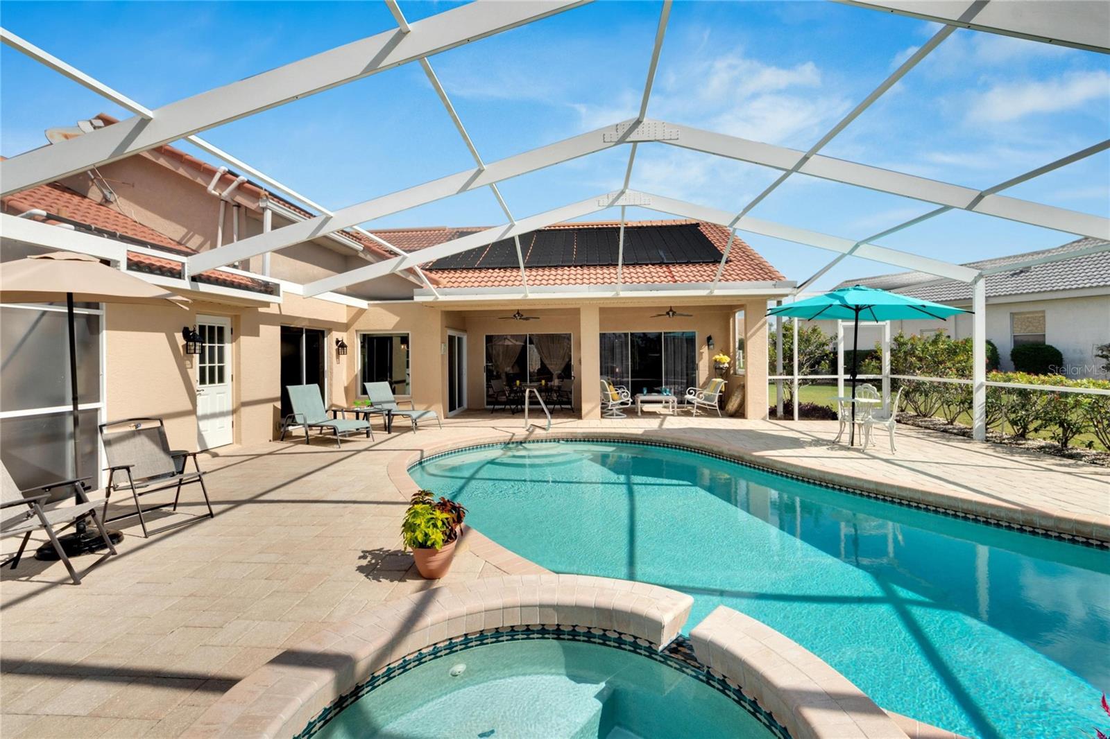 Shaded covered porch with two ceiling fans.