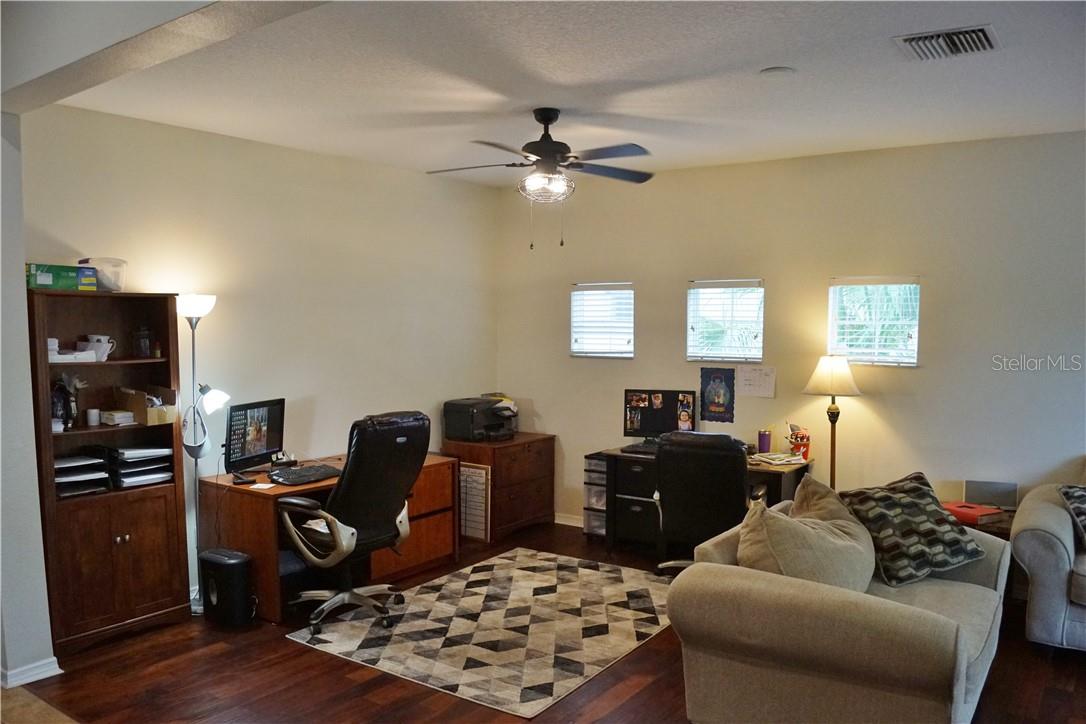 Formal dining space at front of house ( being used as an office)