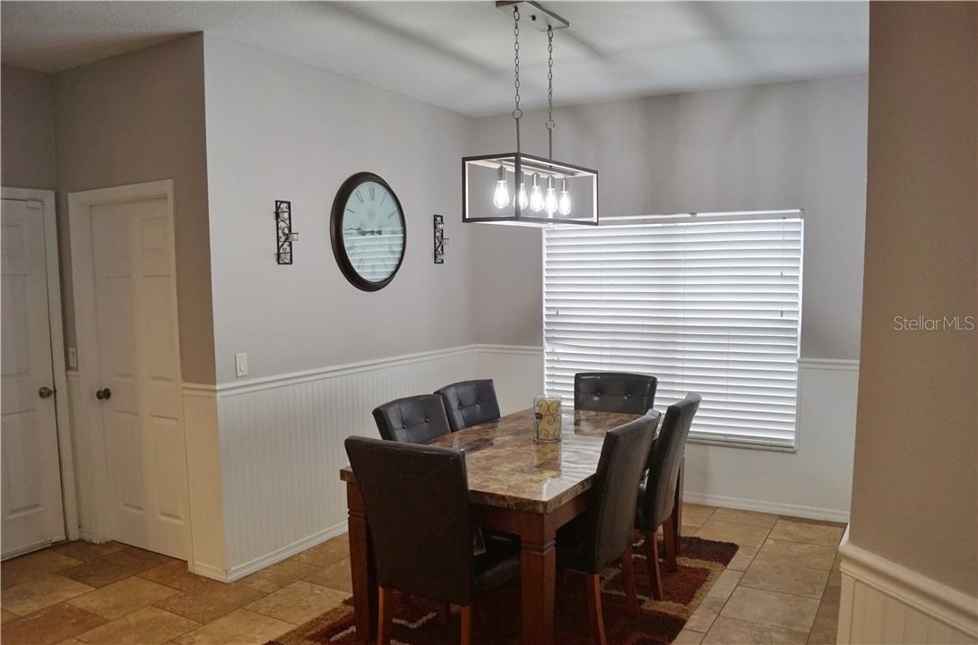 Dining space in kitchen with updated lighting