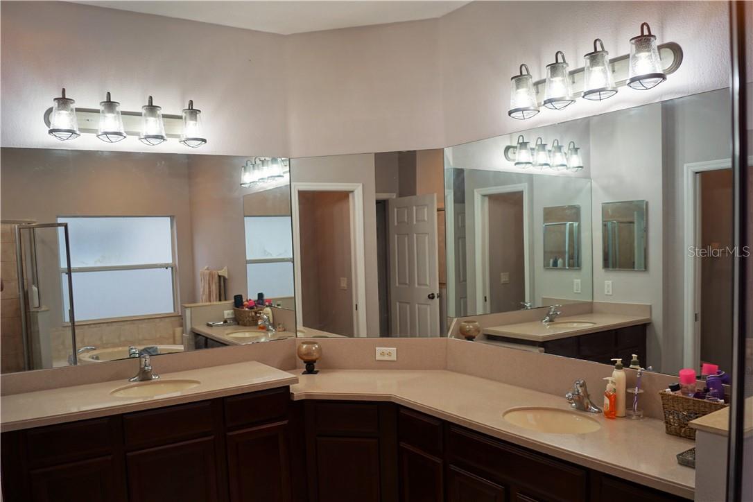 Master Bath is large with his and her vanities, a garden tub and separate shower