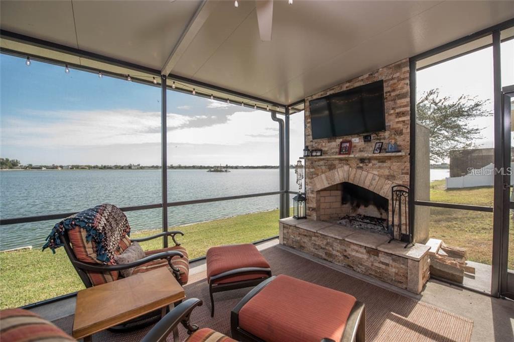 The lanai space is 24x14 and offers a custom wood burning fireplace with gorgeous water views!