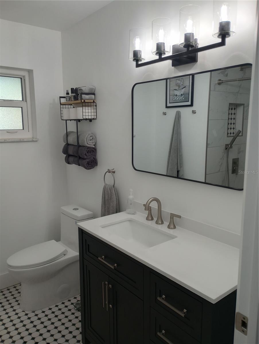 Guest Bath has been totally remodeled with a rain shower and soaking tub.