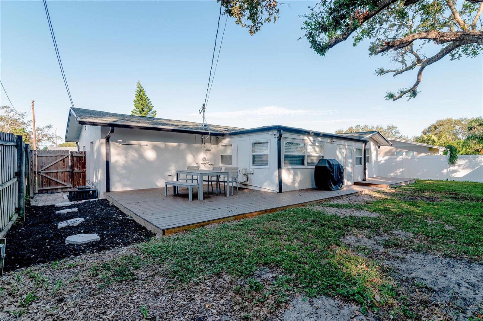 The back yard has a rear deck that is perfect for outdoor meals, entertaining, or perhaps to just relax and read a good book.