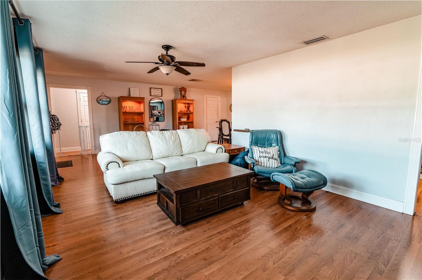 The opposite view of the 12 X25 Living Area. please note in the right corner of the photo is a doorway that leads to the kitchen and garage.