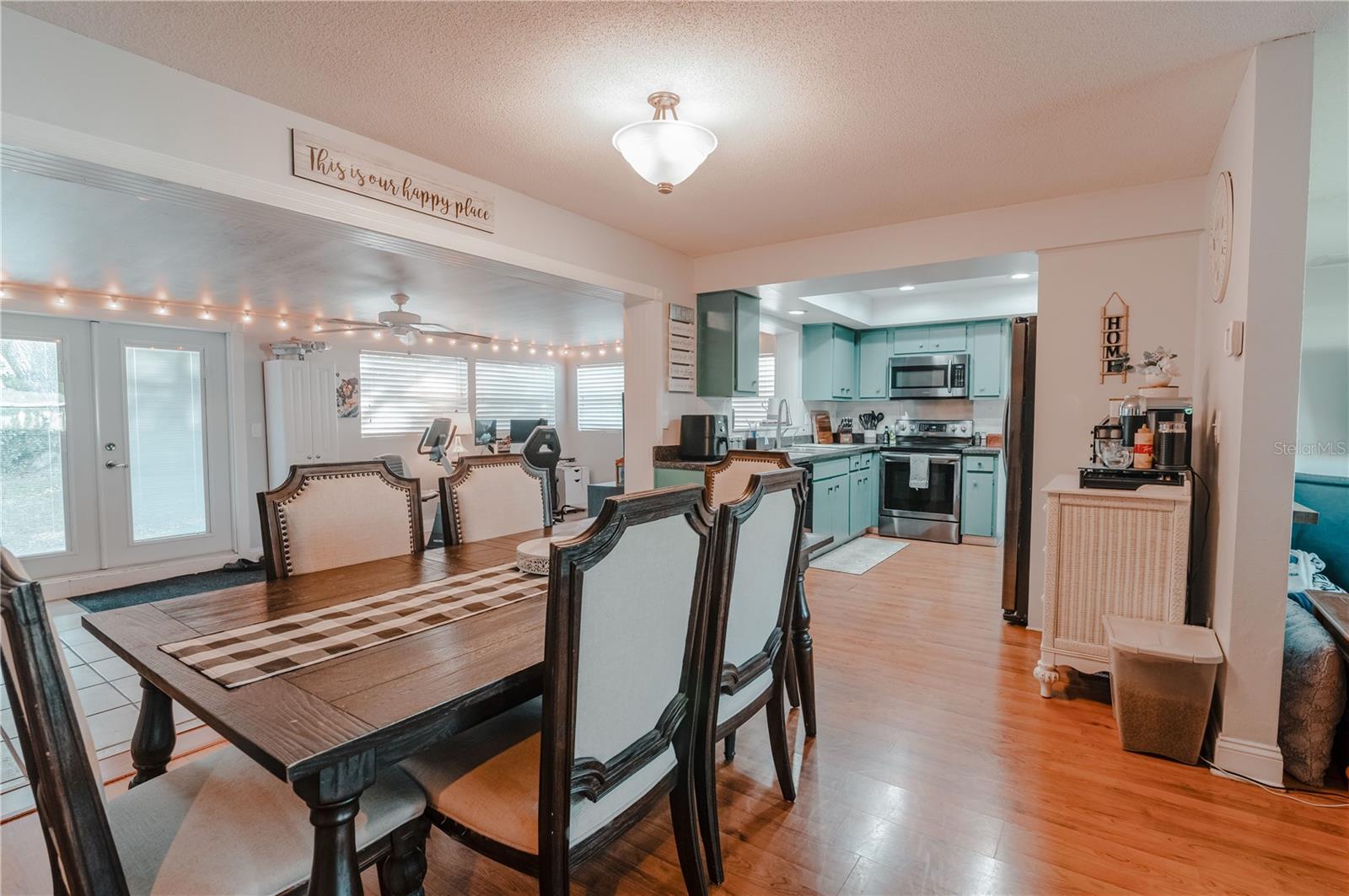 The Dining Area is just off the kitchen. Notice the nook on the right side of the kitchen for extra storage space / coffee station.